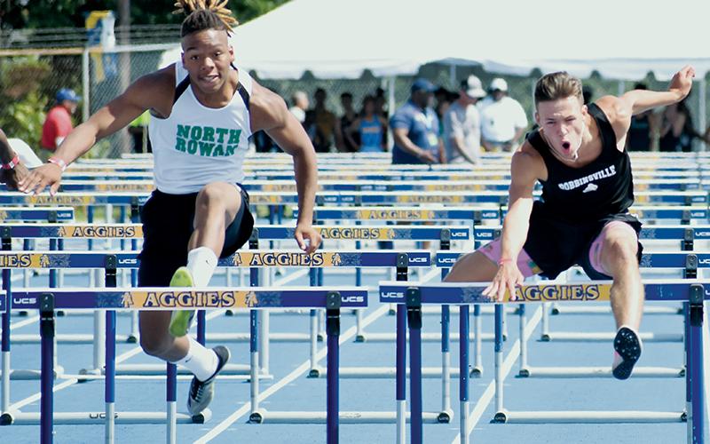Brock Adams (right) bested North Rowan’s Tsion Delaney by 0.10 seconds to win the 110-meter hurdles state championship Friday at N.C. A&amp;T University in Greensboro. Photo by Kevin Hensley/sports@grahamstar.com