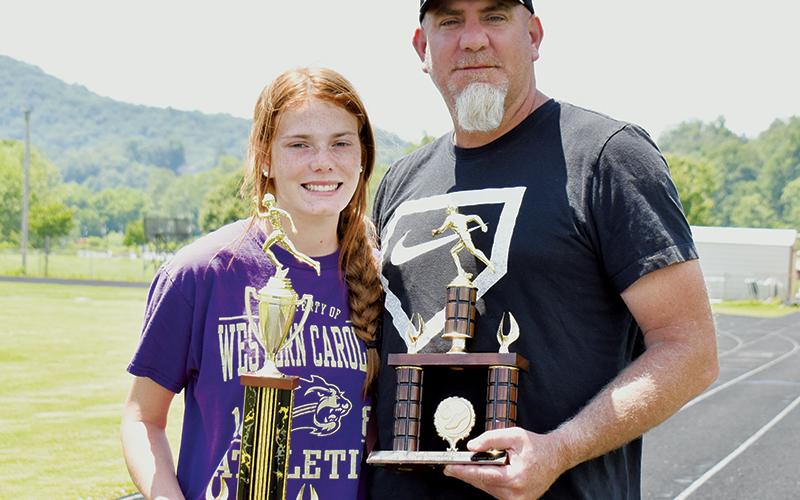 One family, two awards, 30 years apart: Zoie Shuler (left) was named the Most Outstanding Female Track and Field Athlete of the Smoky Mountain Conference championship meet June 9. Her father Michael received the distinction of Most Outstanding Male Field Athlete in both 1991 and 1992. Photos by Kevin Hensley/sports@grahamstar.com
