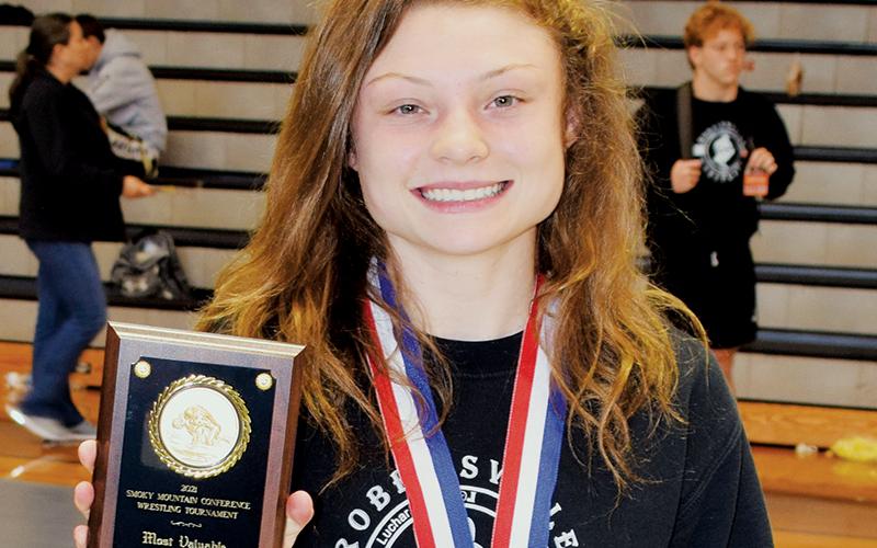 Aynsley Fink was all smiles June 10, moments after being named the Most Valuable Wrestler of the 2020-21 Smoky Mountain Conference Tournament. Fink became the first female to win a Smoky Mountain Conference tournament championship. Photo by Art Miller/amiller@grahamstar.com