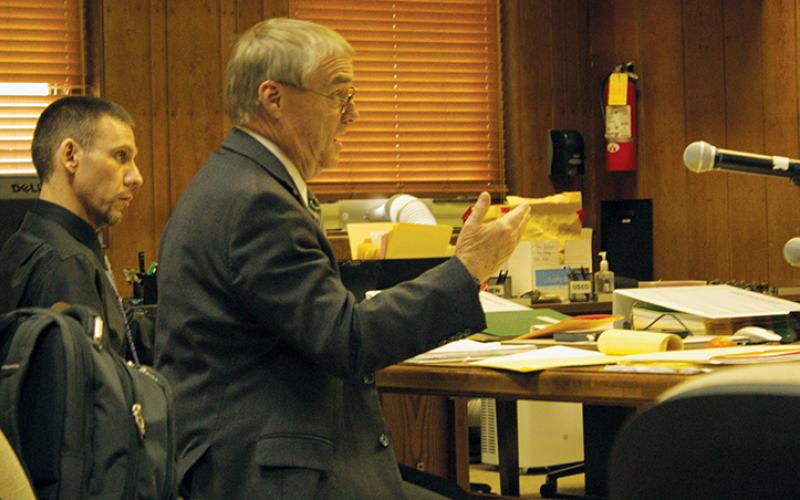 Attorney Michael Fox (left) cross-examines a witness in Graham County Superior Court on Tuesday, as his client – Casey Adam Haney – watches. Photo by Charlie Benton/news@grahamstar.com