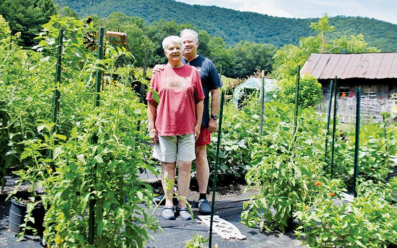 Kathie Hatton (front) and Len Sheffield have spent the last eight years focused on growing a plentiful garden on South Fork Road, following their respective retirements and full-time move to Graham County. Photos by Art Miller/amiller@grahamstar.com