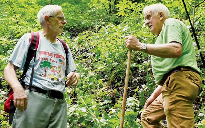 Hoot Gibbs (left) and The Graham Star historical columnist Marshall McClung prepare to measure the height of the secluded falls.