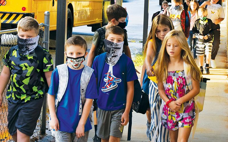 Students returned for the first day of the school year at Robbinsville Elementary on Aug. 16, under the district’s “optional” mask policy. Photo by Art Miller/amiller@grahamstar.com