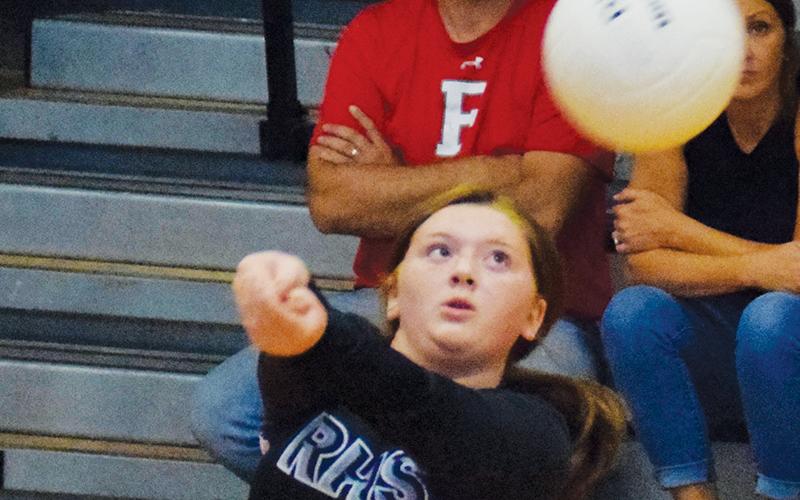 Junior varsity libero Olivia Stewart bumps the ball back to Franklin during Monday’s match.