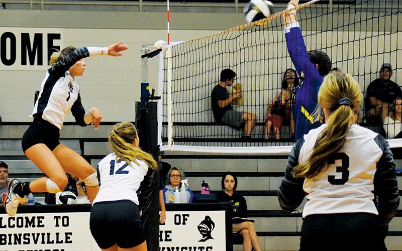 Robbinsville sophomore Delaney Brooms sends a shot screaming past a Highlands defender on Tuesday night. Through her first four games, Brooms has 48 kills. Photos by Art Miller/amiller@grahamstar.com