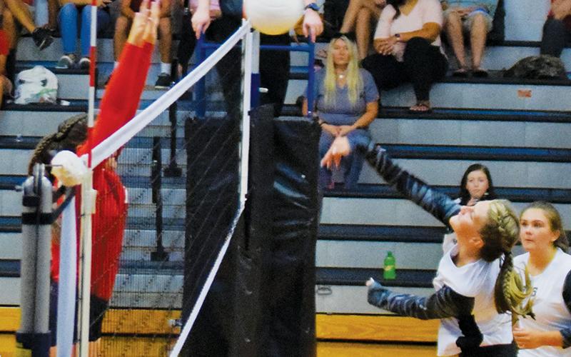 Kelsey Waldroup sends a shot back into Franklin territory during Monday’s season opener against the Lady Panthers. Robbinsville would prevail in a five-set battle. Photos by Art Miller/amiller@grahamstar.com