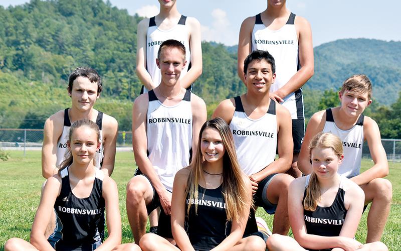 Pictured are the 2021 Robbinsville High School cross-country teams. All names are pictured from left. Seated in front: Liberty Hartley, Delaney Brooms and Greta Whisonant. Second row: Hayden Stewart, William Cable, Xander Wachacha and Jacob Satterfield. Standing in back: Zeb Stewart and Isaiah Brown. Not pictured are Ainslee Munro and Anna Wehr. Photo by Kevin Hensley/sports@grahamstar.com