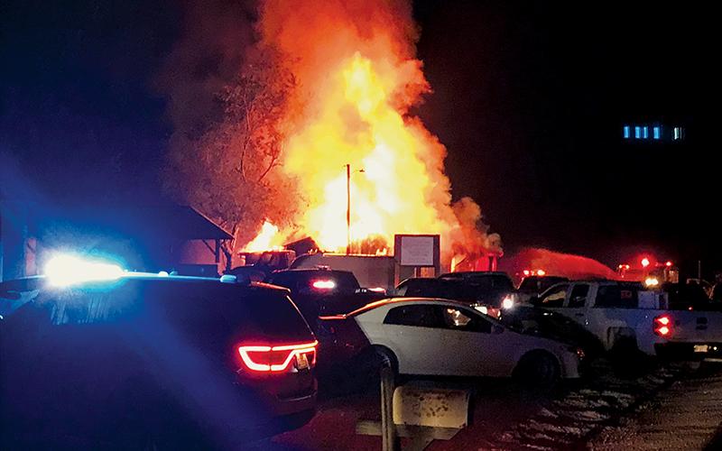 Stecoah Diner was fully engulfed Monday night, shortly after a fire started in the kitchen of the longtime local establishment. Crews deemed the structure a total loss in the wee hours of Tuesday morning. Photo by Kevin Hensley/editor@grahamstar.com