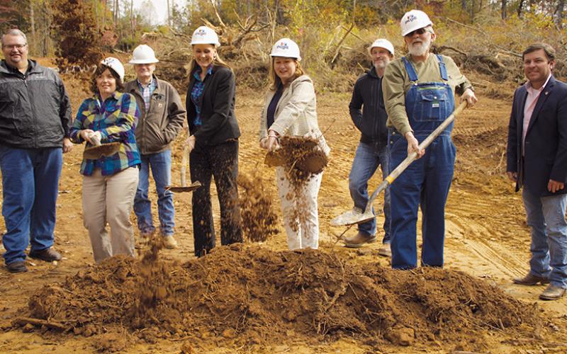 Soil flew through the air as ground was broken on the Rural Development Authority Moose Branch Subdivision Project Tuesday morning. Photo by Charlie Benton/news@grahamstar.com