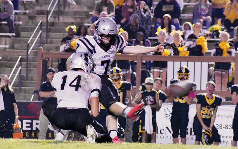 Black Knights senior Cody Cline connects for the game-winning, 42-yard field goal Friday at Murphy. The kick sealed a 23-20 victory for Robbinsville. Photos by Kevin Hensley/sports@grahamstar.com