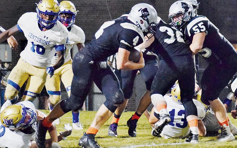 Robbinsville sophomore Cuttler Adams (4) escapes the clutches of a Centurion defender Friday night. Adams had four touchdowns and a two-point conversion in the Knights’ 46-43 loss to Broome, S.C. Photo by Art Miller/amiller@grahamstar.com