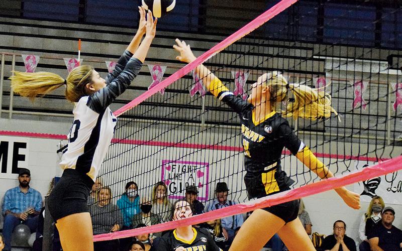 Yeika Jimenez (left) stretches to block a tip by Murphy’s Torin Rogers during Oct. 7’s conference match. Photos by Art Miller/amiller@grahamstar.com