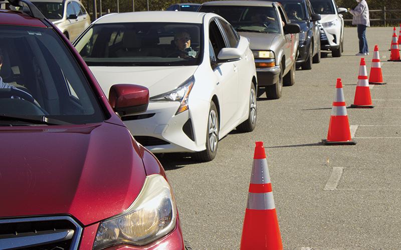 Cars queue up at a mass vaccine clinic held Saturday in Robbinsville. The event was the largest of its kind held in the county to date, and saw 248 people take the vaccine. Photo by Charlie Benton/news@grahamstar.com