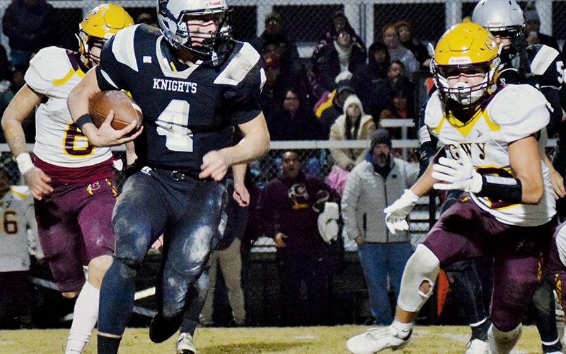 Cuttler Adams evades the pursuit of two Cherokee defenders during Friday’s second-round playoff victory over the Braves. Adams had four rushing touchdowns in the game. Photos by Art Miller/amiller@grahamstar.com