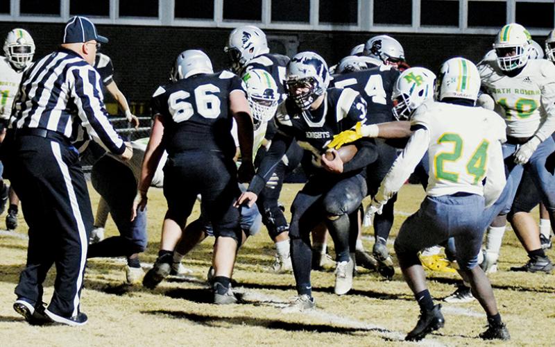 Sophomore fullback Kage Williams pushes across the goal line Friday night against North Rowan. Williams had two rushing touchdowns in Robbinsville’s 50-47 third-round playoff win over the Cavaliers. Photo by Art Miller/amiller@grahamstar.com