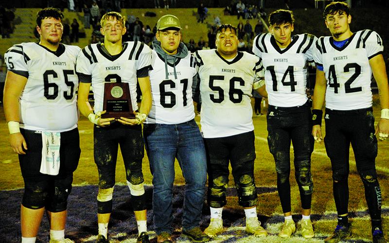 An emotional group of Black Knights accept the N.C. High School Athletic Association’s 1A Western Regional runner-up plaque Friday night at Mitchell High School. From left are Carson White, Isaac Wiggins, Drake Hill, Carlos Wesley, Dasan Gross and Eddie Brooms. Photo by Zack Colburn/ZWCSports