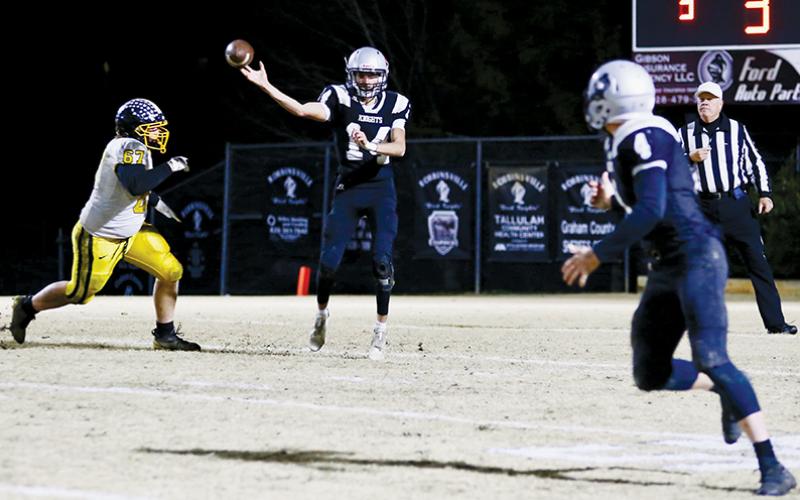 Dasan Gross fires a rocket to Cuttler Adams during Friday’s fourth-round playoff game against Murphy. In Gross’ strongest showing to date, the senior quarterback finished the game 9-of-11, with 136 passing yards and seven, third-down conversion completions. Photos by Miranda Buchanan/Robbinsville High School Yearbook