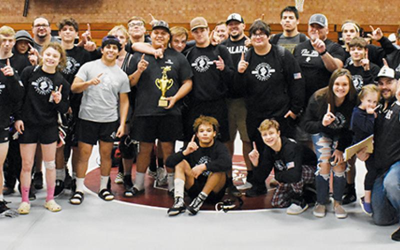 Members of the Robbinsville wrestling program pose with the 2021 Devil Duals trophy, after the Knights conquered the field Dec. 22. Photos by Kevin Hensley/sports@grahamstar.com