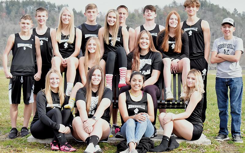 The 2021-22 Robbinsville High School indoor track team. All names are from left. Front row: Haize Moore, Montana Buchanan, Lisbeth Cervantes and Caylin Lunsford. Second row: Kensley Phillips, Taelyr Jackson, Delaney Brooms and Zoie Shuler. Back row: Jacob Satterfield, Zeb Stewart, Caden Lail, William Cable, Roman Jones, Kamdyn Jordan and Josh Satterfield. Not pictured is Koleson Dooley. Photo by Kevin Hensley/sports@grahamstar.com