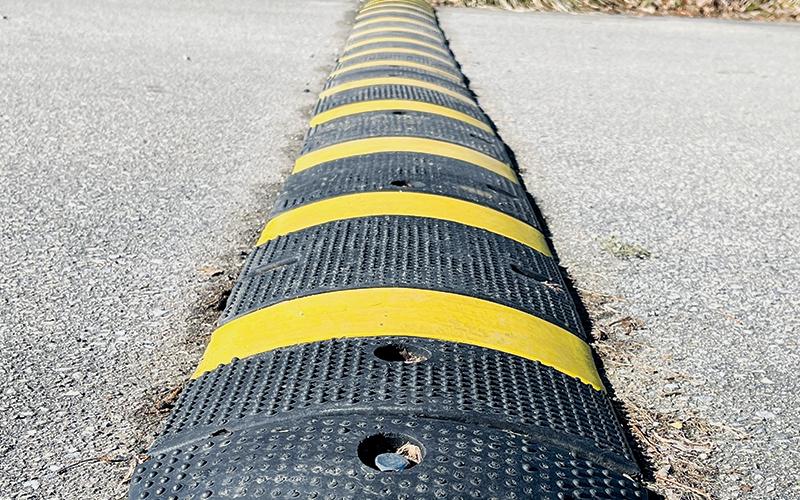 Speed bumps, like this one bolted onto Cody Street in Robbinsville, are designed to encourage drivers to slow down in a fairly-aggressive way. Photos by Randy Foster/news@grahamstar.com