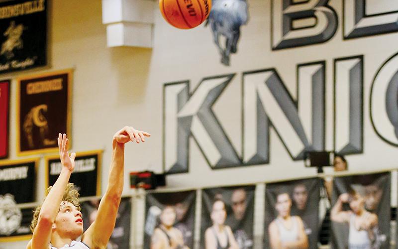 Senior Kamdyn Jordan puts up a floater during Dec. 30’s home victory over Tellico Plains, Tenn. Photo by Miranda Buchanan/Robbinsville High School Yearbook