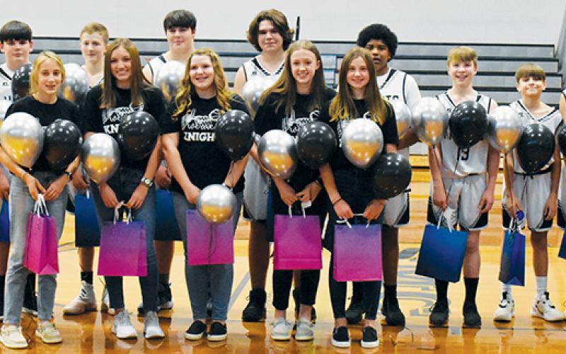 Prior to Monday’s game, Robbinsville Middle School recognized the 8th-grade members of its basketball program. All names are listed from left. Front row: Anna Williams, Katie Lyn Gross, Lady Knights manager Jernie Greene, Maleah Cox and Abby Wehr. Back row: Luke Lovin, Dane Knott, Isiac Collins, Tillman Adams, Owen Blevins, Dane Daniels, Kyzik Teesateskie, Benny Moose, Tyler Patton, Javian Blair and Kasen Buchanan. Photo by Kevin Hensley/sports@grahamstar.com