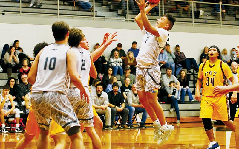 Xander Wachacha takes center stage during Feb. 3's home victory over Cherokee. Photo by Miranda Buchanan/Robbinsville High School Yearbook