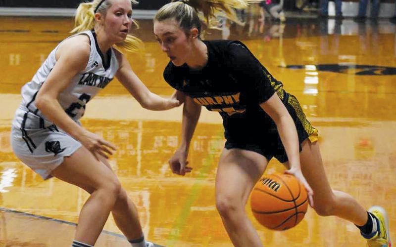 Robbinsville’s Kensley Phillips tries to slow down the progress of Murphy’s Torin Rogers on Tuesday. Photo by Justin Fitzgerald/Cherokee Scout