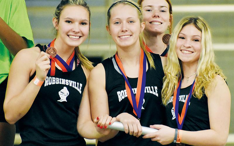 The Robbinsville Lady Knights’ 4x200 relay team finished third at the 1A/2A state championship meet Friday. From left are Delaney Brooms, Kensley Phillips, Zoie Shuler and Caylin Lunsford.
