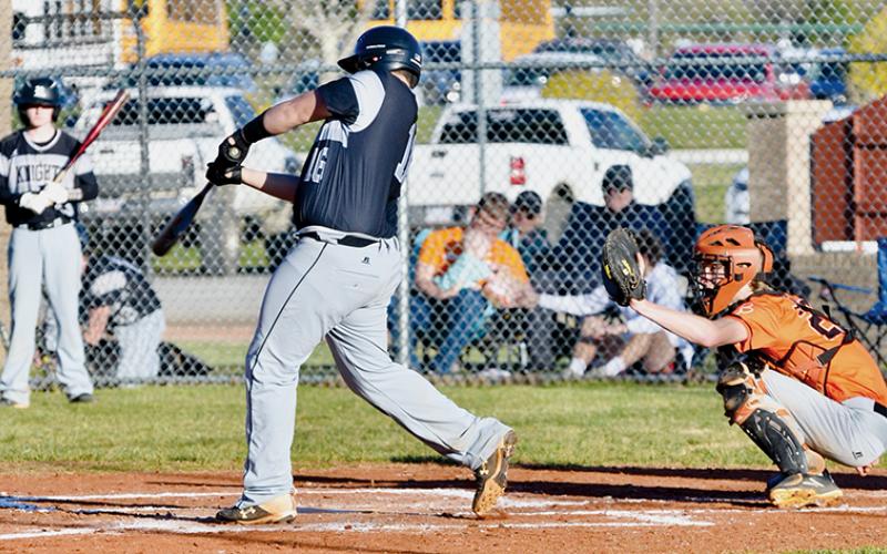Robbinsville freshman Dayne Webster puts a charge into a pitch during March 10’s home opener against Rosman. Webster’s connection resulted in a solo home run. Photo by Raven Rattler/Robbinsville High School Yearbook