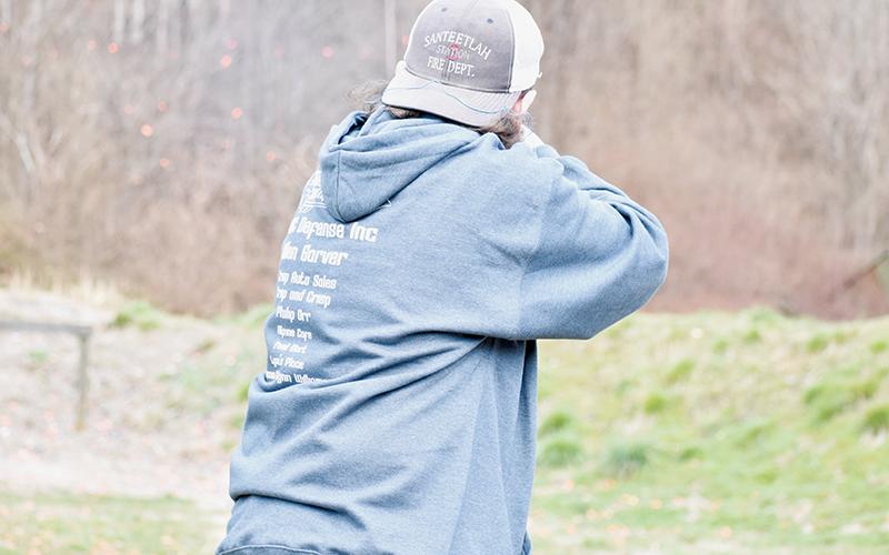 Robbinsville High’s Cyler Orr disintegrates a clay target during the trap competition at Saturday’s FarWest Tournament in Marble. Photo by Kevin Hensley/sports@grahamstar.com