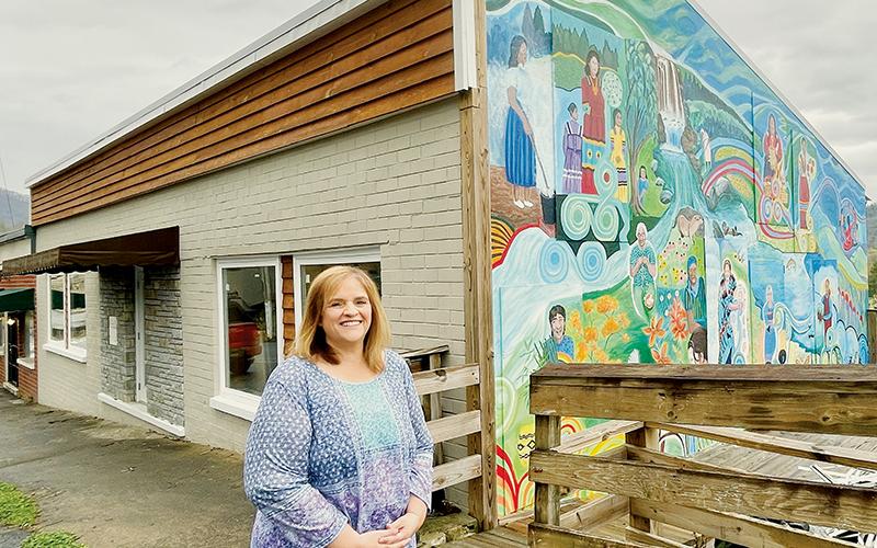 Angie Knight, superintendent of Graham County Schools, in front of the old VFW building on Main Street in Robbinsville. The school district received a $511,500 grant to restore and convert the building into a sandwich and coffee shop – as well as imprinting shop – to teach high school students real-world skills. Photo by Randy Foster/news@grahamstar.com