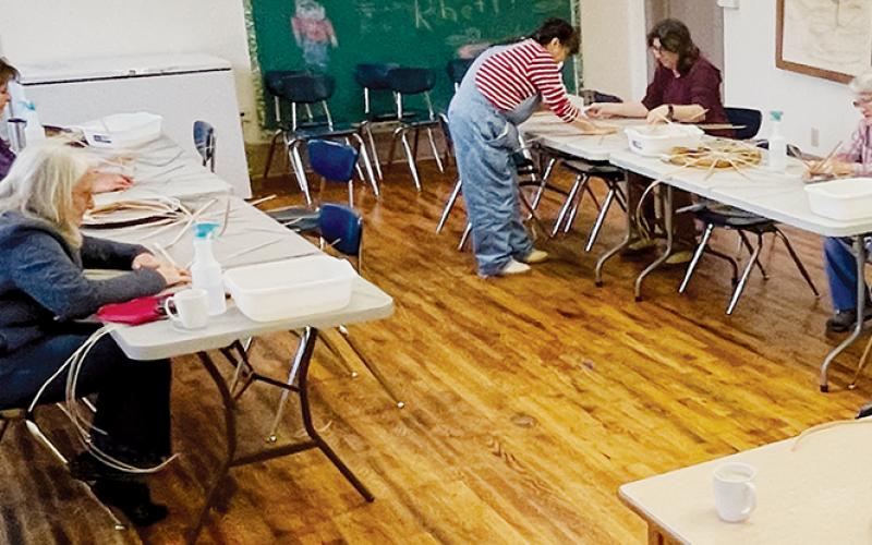 Instructor Ramona Lossie (standing) teaches basket weaving at Stecoah Center on Saturday. Seated from left are Connie Follstad, Marie DiCataldo, Amber Benton and Bonnie Powell.