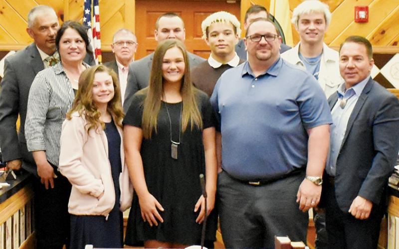 xFlanked by members of the tribal council – as well as his family – Todd Odom (center, second from right on front row) was  inducted as an honorary member of the Eastern Band of Cherokee Indians on April 7. Photos by Kevin Hensley/editor@grahamstar.com