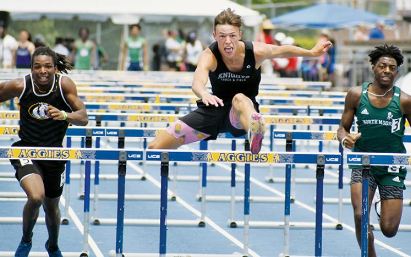 Black Knights junior Brock Adams (center) outpaced North Moore’s Michael Copeland (right) and Murphy’s Juan Allen to successfully defend his 110-meter hurdles championship Saturday. Adams later won his first 300-meter hurdles state crown.