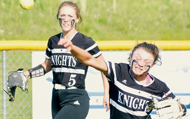 With Halee Anderson backing her up, senior Aynsley Fink fires in a throw from right-center field Monday at Hiwassee Dam. Photos by Kevin Hensley/sports@grahamstar.com
