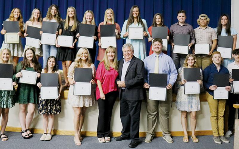 Twenty Robbinsville High School seniors were awarded the Cody Family Scholarship at May 26's academic banquet. All names are listed from left. Front row: Sarah Gibby, Klancy Stevens, Brynn Harn, Patience Frapp, Dana Adams, Dirk Cody, Carson White, Cheyenne Rowland, Jacob Hall and Aidan Farley. Back row: Halee Anderson, Baylee Parham, Yeika Jimenez, Kelsey Waldroup, Reagan Ditmore, Haize Moore, Ivy Odom, Keylie Jordan, Cody Cline, Jaret Panama and Montana Buchanan. Not pictured is Marco Beltran.