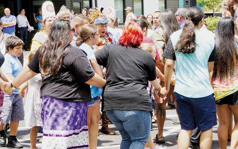 Bo Taylor (center) leads a friendship dance following the ribbon cutting at the Jacob Cornsilk Community Center in the Snowbird community on Friday. Photos by Randy Foster/news@grahamstar.com