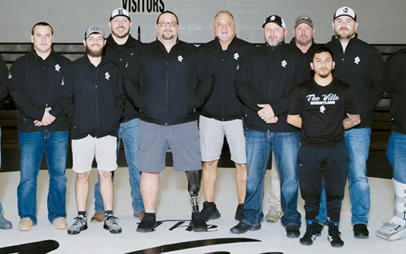 The 2021-22 Robbinsville High School wrestling coach staff was recently named the National Wrestling Coaches Association’s Boys Assistant Staff of the Year for North Carolina. From left are Colby White, D.J. Robinson, Weston Haney, Josh Winfrey, head coach Todd Odom, James Keifer, Travis Hooper, Billy Knight, Irvin Portugal, Wren Millsaps and Josiah Phillips. Not pictured are Jason Tom Sawyer, Brandon Lee and Carter Williamson. Photo courtesy of Maria Shook Photography