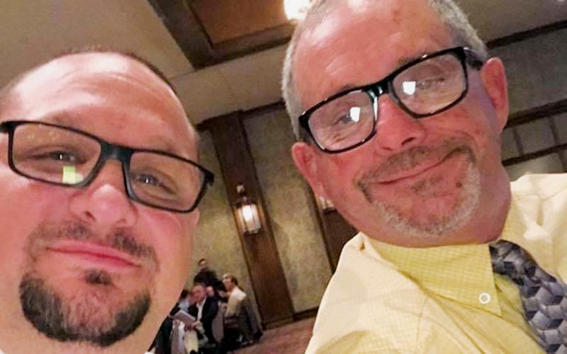 Todd Odom (left) – who just retired after coaching the Black Knights for 18 years – pauses with David Haney at a banquet in Asheville. Haney has been named as Odom’s successor, which will be the fourth time Haney has been the head coach of the Robbinsville wrestling program.