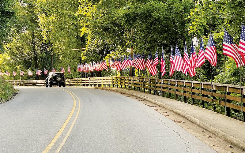 Work is in progress to rename East Main Street in Robbinsville “Veteran Hill.” Here, the street is decked out with U.S. flags and memorials for Memorial Day Weekend. Photo by Randy Foster/news@grahamstar.com