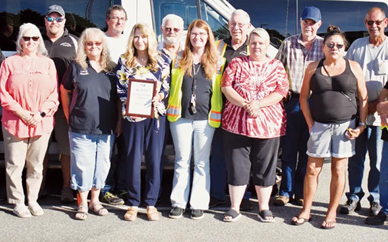 For the fourth time in five years, Graham County Transit has been recognize with a Safety Award from the N.C. Public Transportation Association. All names are listed from left. Front row: Tracy Jenkins, Donna Hill, transit director Juanita Colvard, Penny Postell, Jennifer Conley, Donna McCracken and Kenny Blevins. Back row: Michael Collins, Michael Badalucca, Andrew Hyde, Terry Crawford, Lamar Carver, Frank Deyton and Tommy Holland. Photo by Kevin Hensley/editor@grahamstar.com