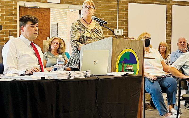 Town of Lake Santeetlah council member Diana Simon answers questions from attorney John Noor at the July 7 preliminary voter challenge hearing with the Graham County Board of Elections. Seated in the gallery between Noor and Simon is council member Tina Emerson, who is one of eight in Lake Santeetlah being challenged. Photo by Kevin Hensley/editor@grahamstar.com