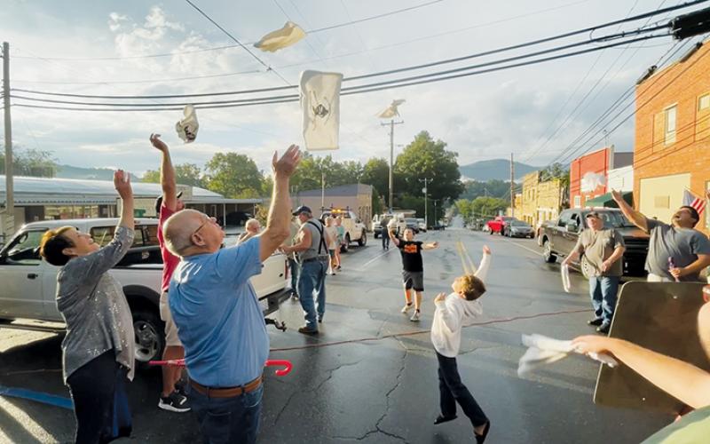 In a fitting tribute to late Black Knights megafan Billy Ed Queen, spectators attending Friday’s  kickoff to the two-day 150th anniversary celebration in Robbinsville were given white towels to toss into the air – a move patented by Queen whenever Robbinsville would score a touchdown. Photos by Randy Foster/news@grahamstar.com