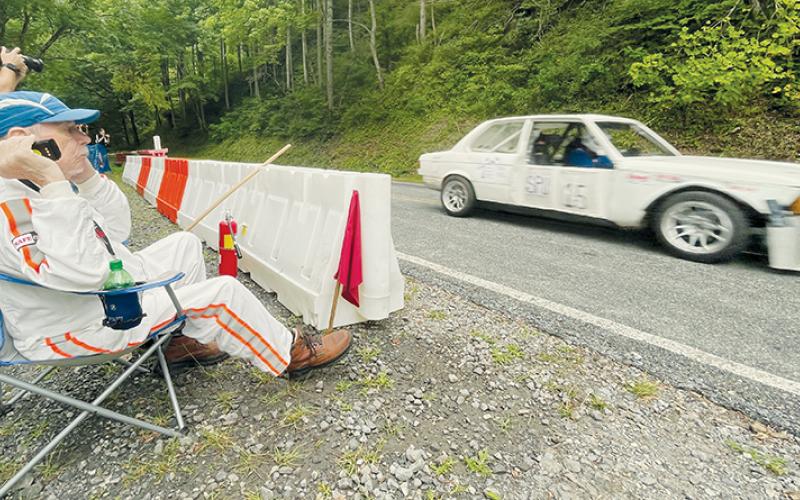 Asheville-area resident Mike Plemmons looks on as a car goes flying by during Saturday’s leg of the CCR-SCCA Dragon Hill Climb, which was held inside the Joyce Kilmer Memorial Forest. Plemmons has been involved with racing for over 40 years. Visit our Facebook page for more photos from Saturday’s portion of the event. Photos by Randy Foster/news@grahamstar.com