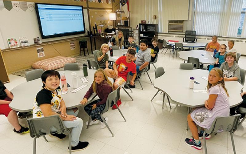 Pupils in Morgan Postell’s third-grade class at Robbinsville Elementary School were in a cheerful mood on their first day back Monday. Photo by Randy Foster/news@grahamstar.com