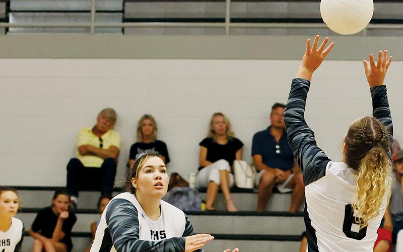Aubrie Wachacha (left) breaks to hammer the set from Desta Trammell during Tuesday’s home match against Highlands. Photo courtesy of Miranda Buchanan/Robbinsville High School Yearbook