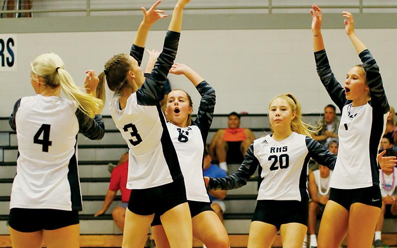 Robbinsville’s Kensley Phillips, Claire Barlow, Desta Trammell, Suri Watty and Delaney Brooms (from left) celebrate after a kill during Tuesday’s home opener against Asheville Christian Academy. Photo by Miranda Buchanan/Robbinsville High School Yearbook