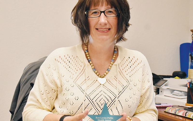 Graham County Health Director Beth Booth displays her Ron Levine Public Health Award, which was given to all directors in North Carolina. Photo by Kevin Hensley/editor@grahamstar.com