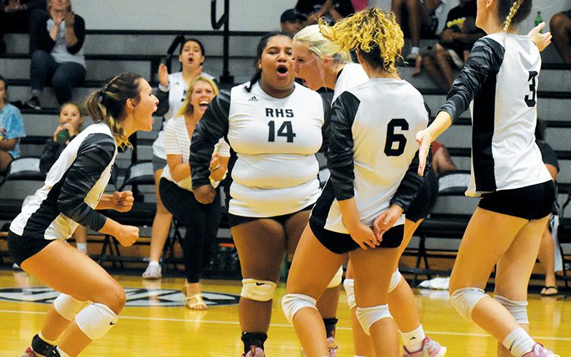 Robbinsville’s Delaney Brooms, Tai Owle, Kensley Phillips, Desta Trammell and Claire Barlow (from left) erupt after a decisive kill Sept. 1 against Murphy. The Lady Knights handed the Bulldogs a 4-set loss. Photo by Justin Fitzgerald/Cherokee Scout